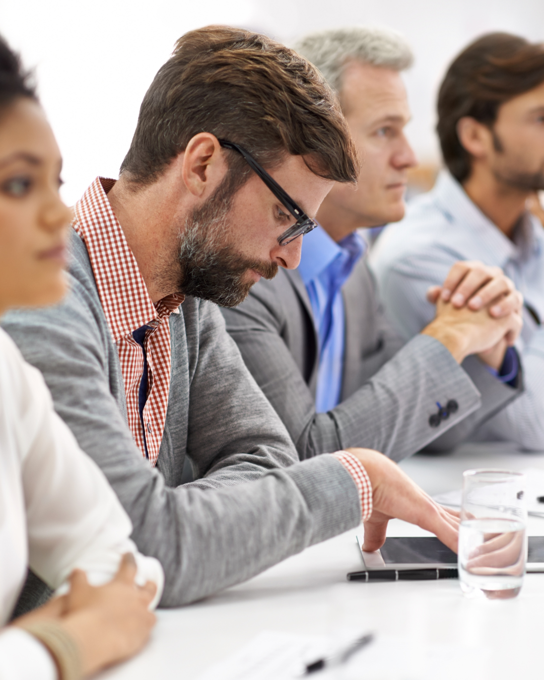 Man sitting in a meeting George Harb, Man sitting in a meeting